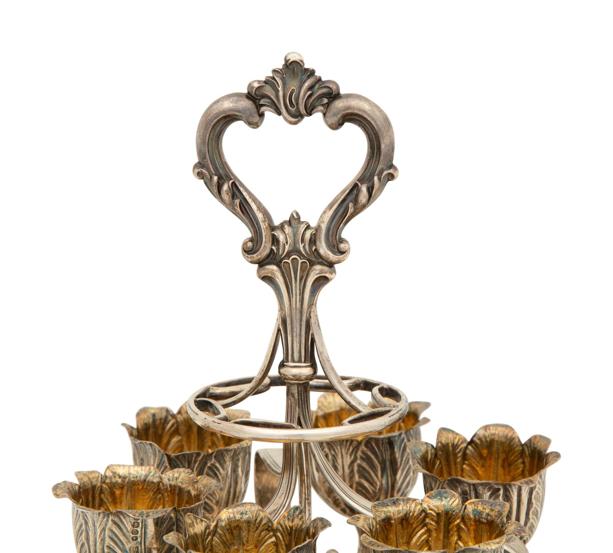 An English Silver Six-Egg Cruet and Footed Silver and Cobalt Glass Basket