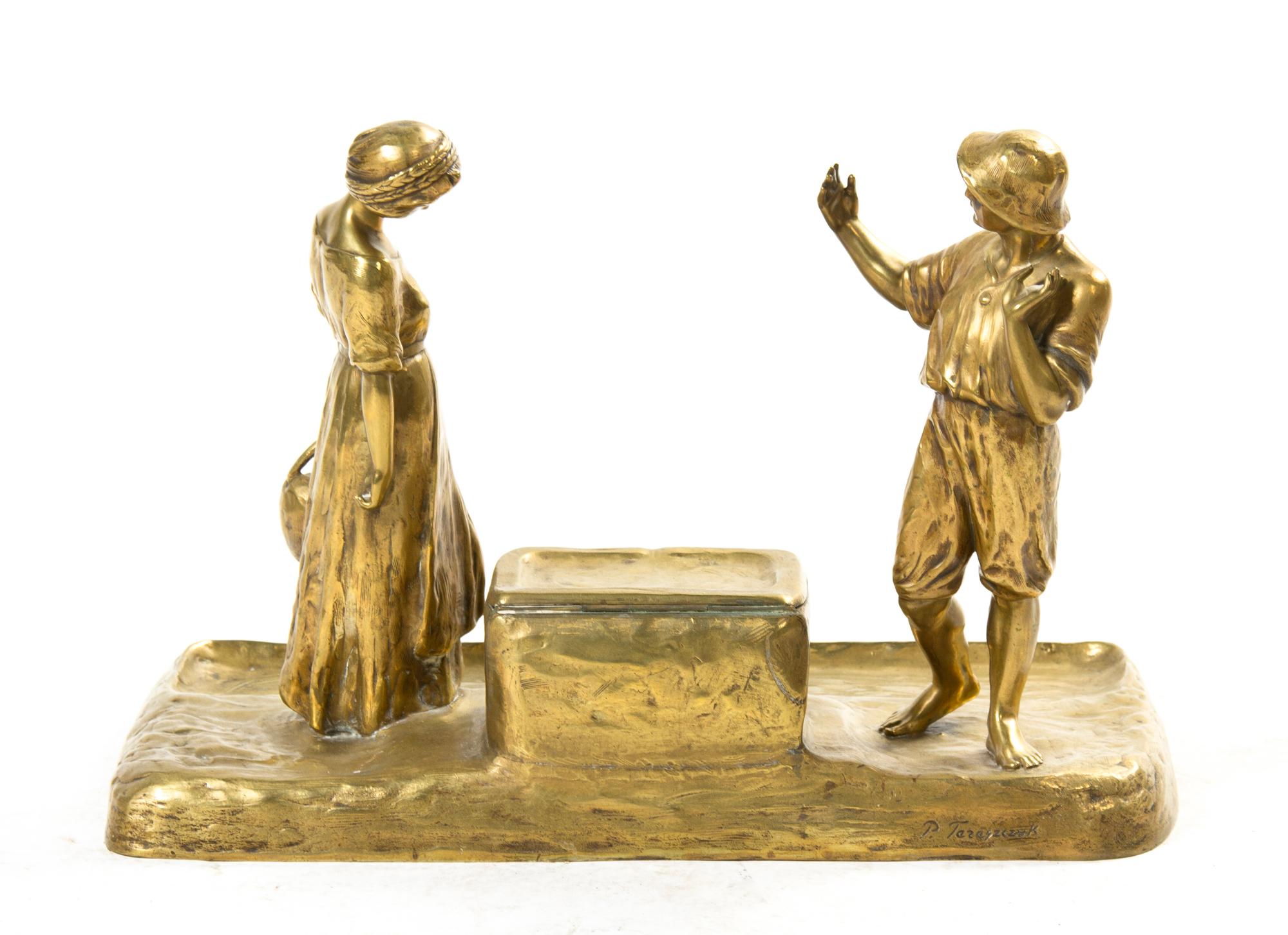 An Austrian Gilt Bronze Figural Encrier, Peter Tereszczuk (1875-1963), Height 11 x width 15 1/2 x depth 8 inches.
