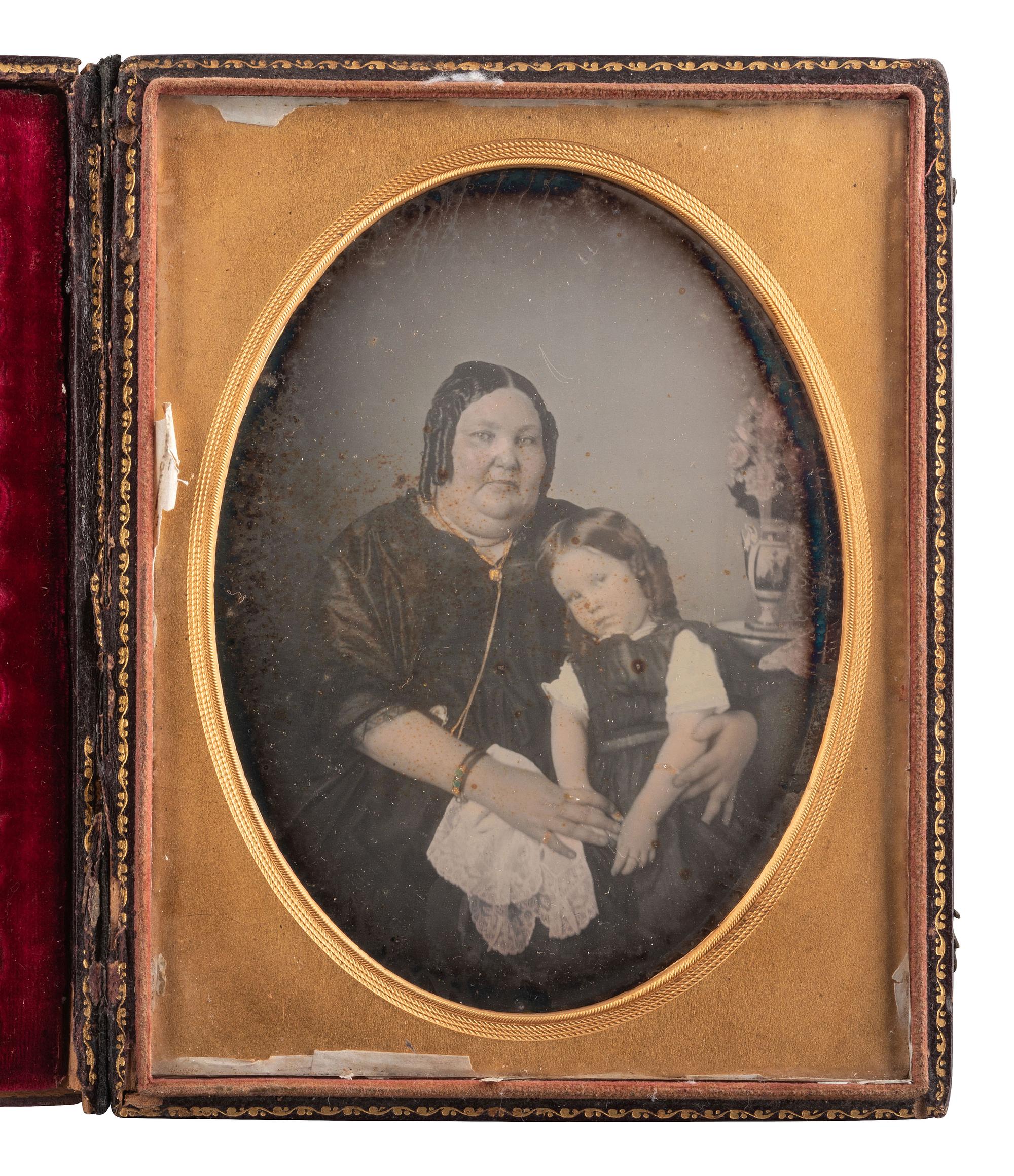 [EARLY PHOTOGRAPHY]. A pair of half plate daguerreotype portraits featuring a full-figured woman with a young girl comprising: