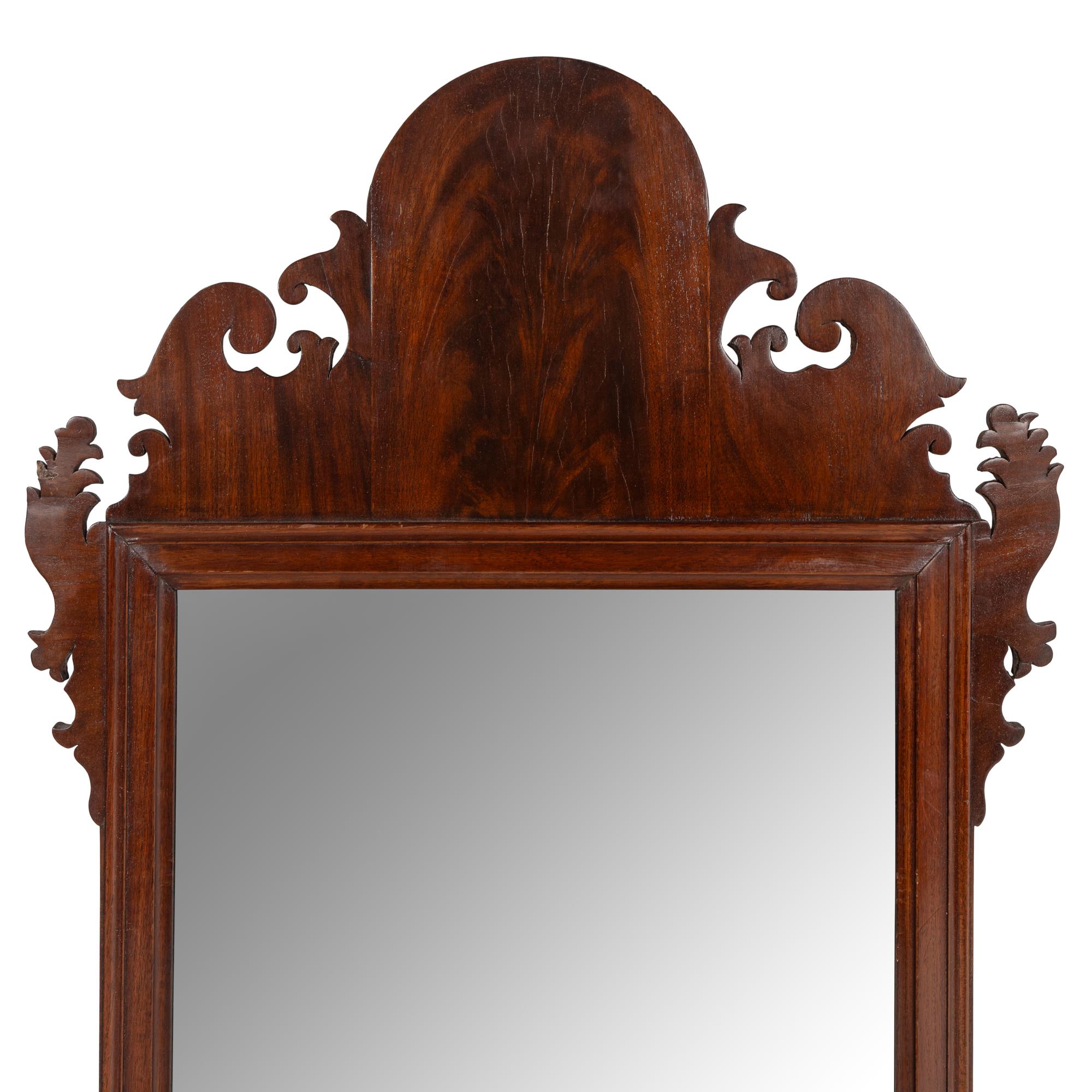 A Chippendale Carved and Figured Mahogany Looking Glass
