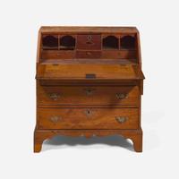 A Federal child's cherry slant-front desk together with a needlework sampler late 18th / early 19th century