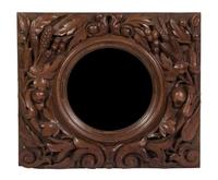 A Victorian Carved Walnut Bullseye Mirror Height 21 x width 24 x depth 3 inches.