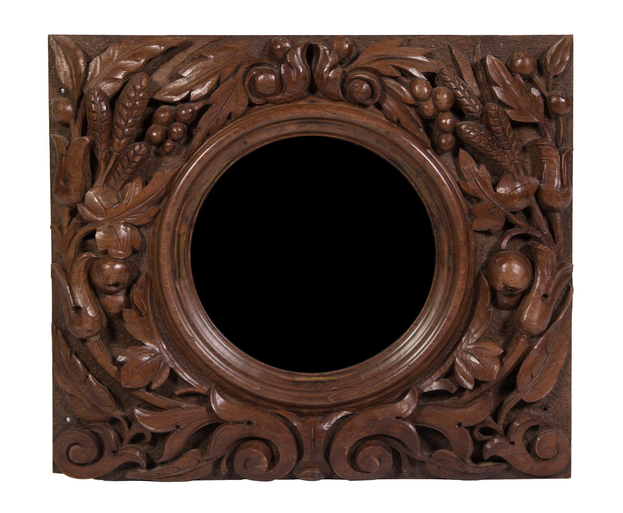 A Victorian Carved Walnut Bullseye Mirror Height 21 x width 24 x depth 3 inches.