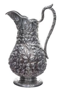An American Silver Pitcher, Andrew Ellicott Warner, Baltimore, MD, 19th Century, having floral and foliate repousse decoration on a sti