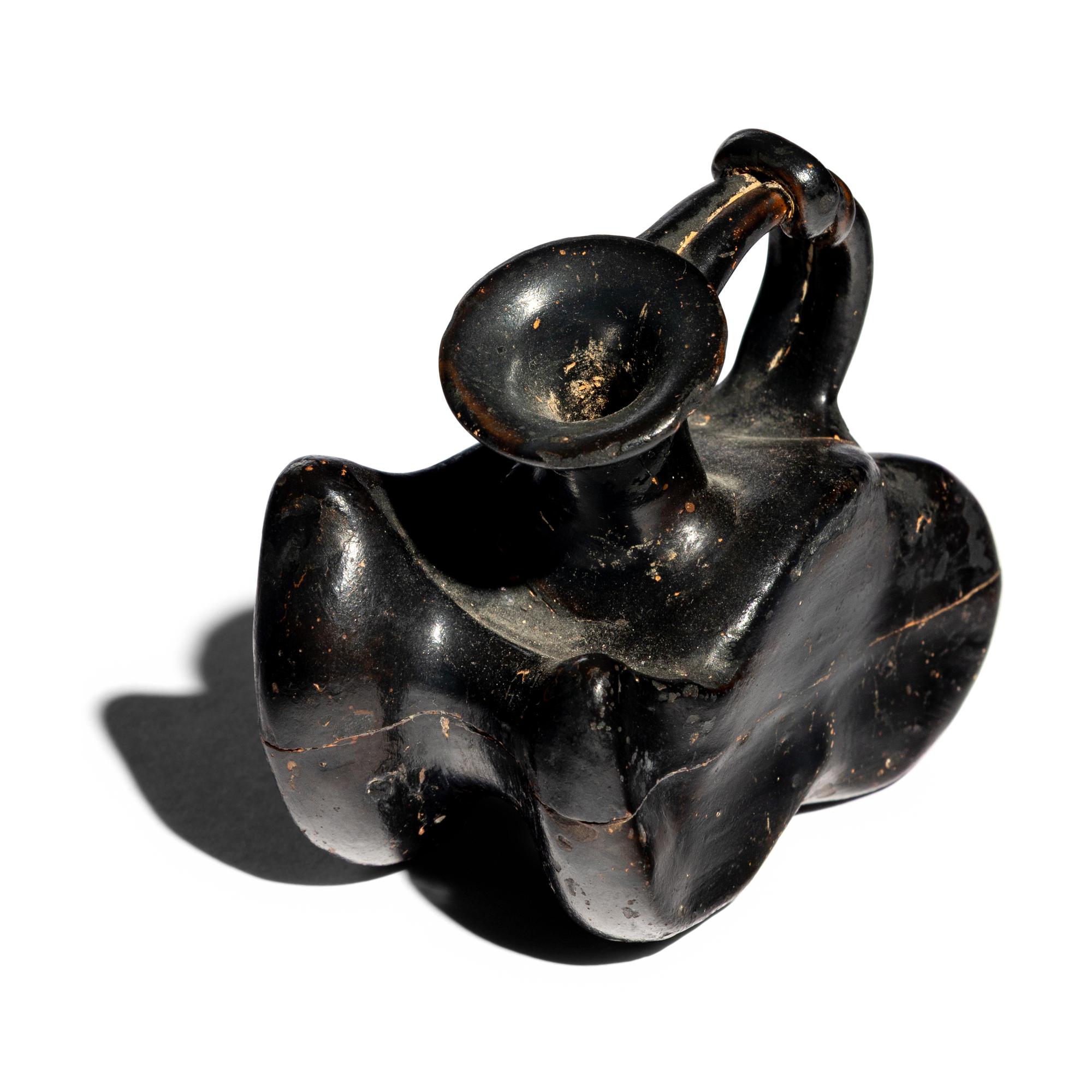 A Greek Black-Glazed Figural Askos