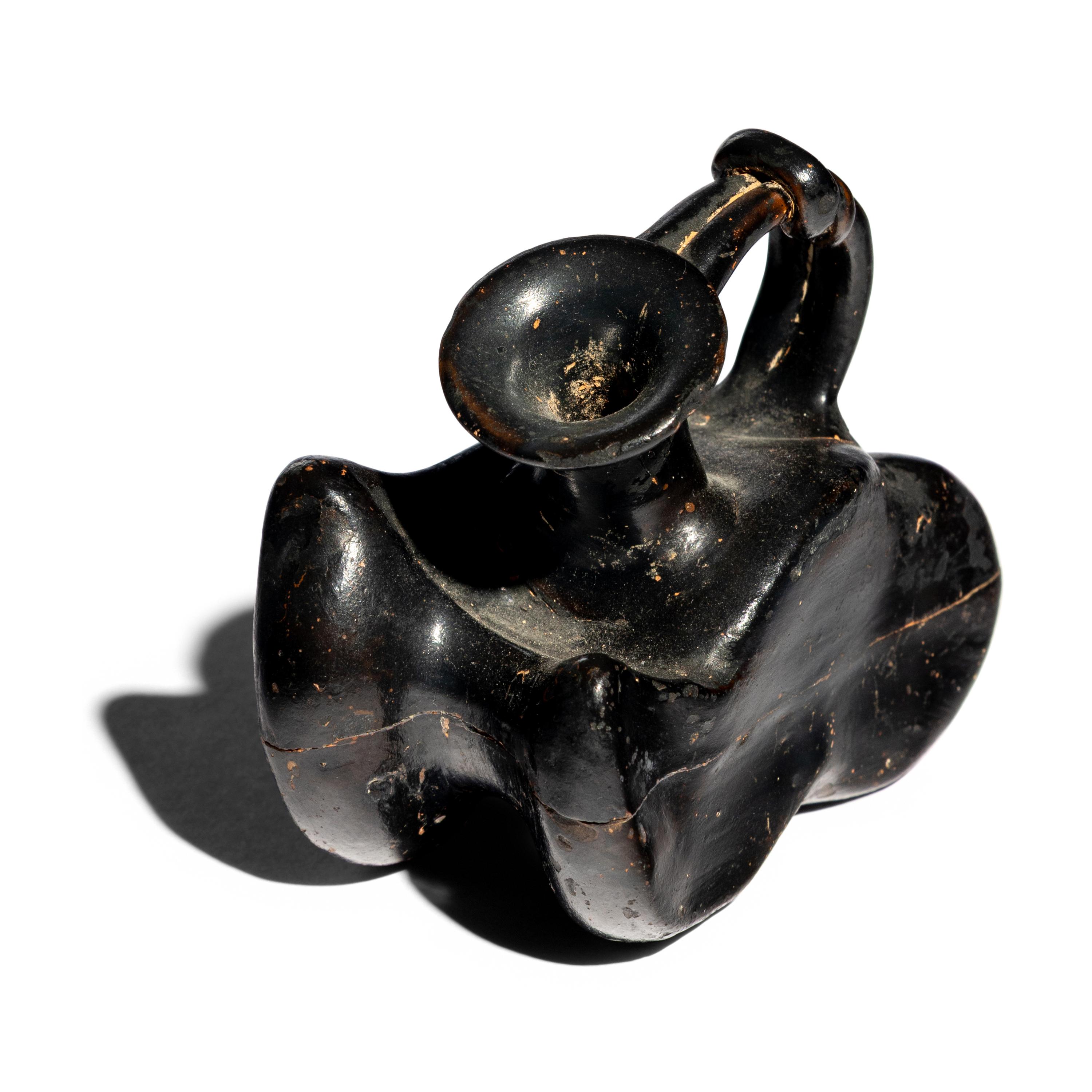 A Greek Black-Glazed Figural Askos