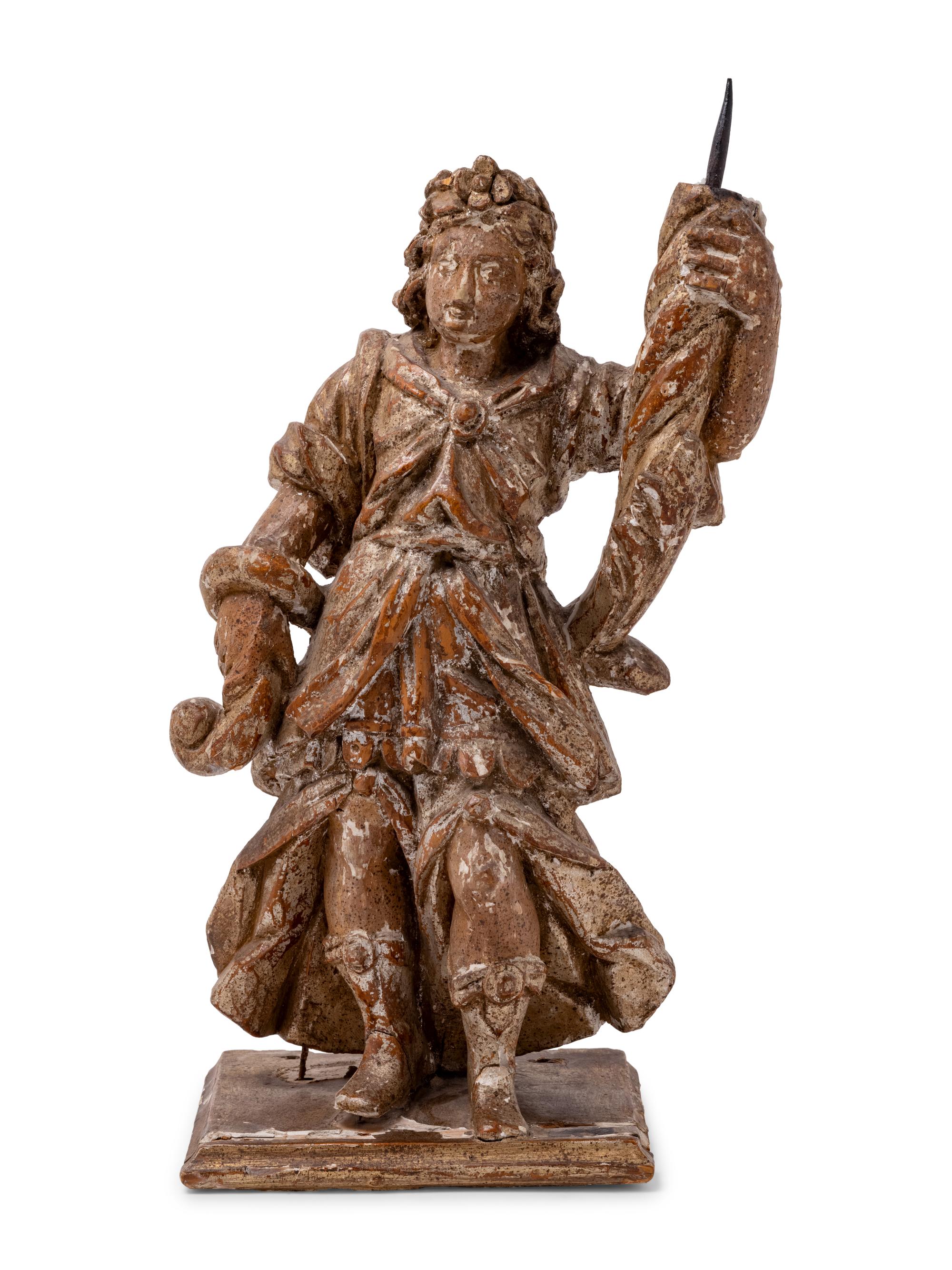 A Continental Carved Santo Figure with Remnants of Polychrome