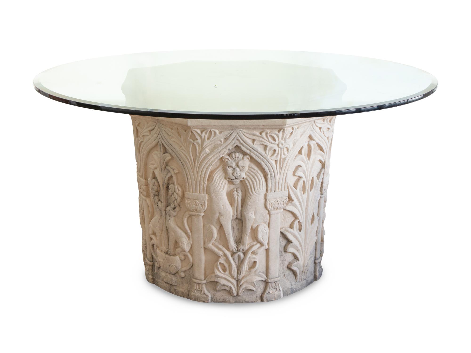 A Carved Stone Pedestal Center Table with Glass Top