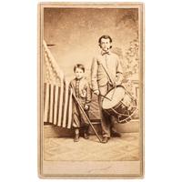 COLLINS, T.P., photographer. Patriotic Civil War CDV of brothers Oliver and Frederick Hutchinson with flag and eagle drum. Westfield, MA: [1860s].