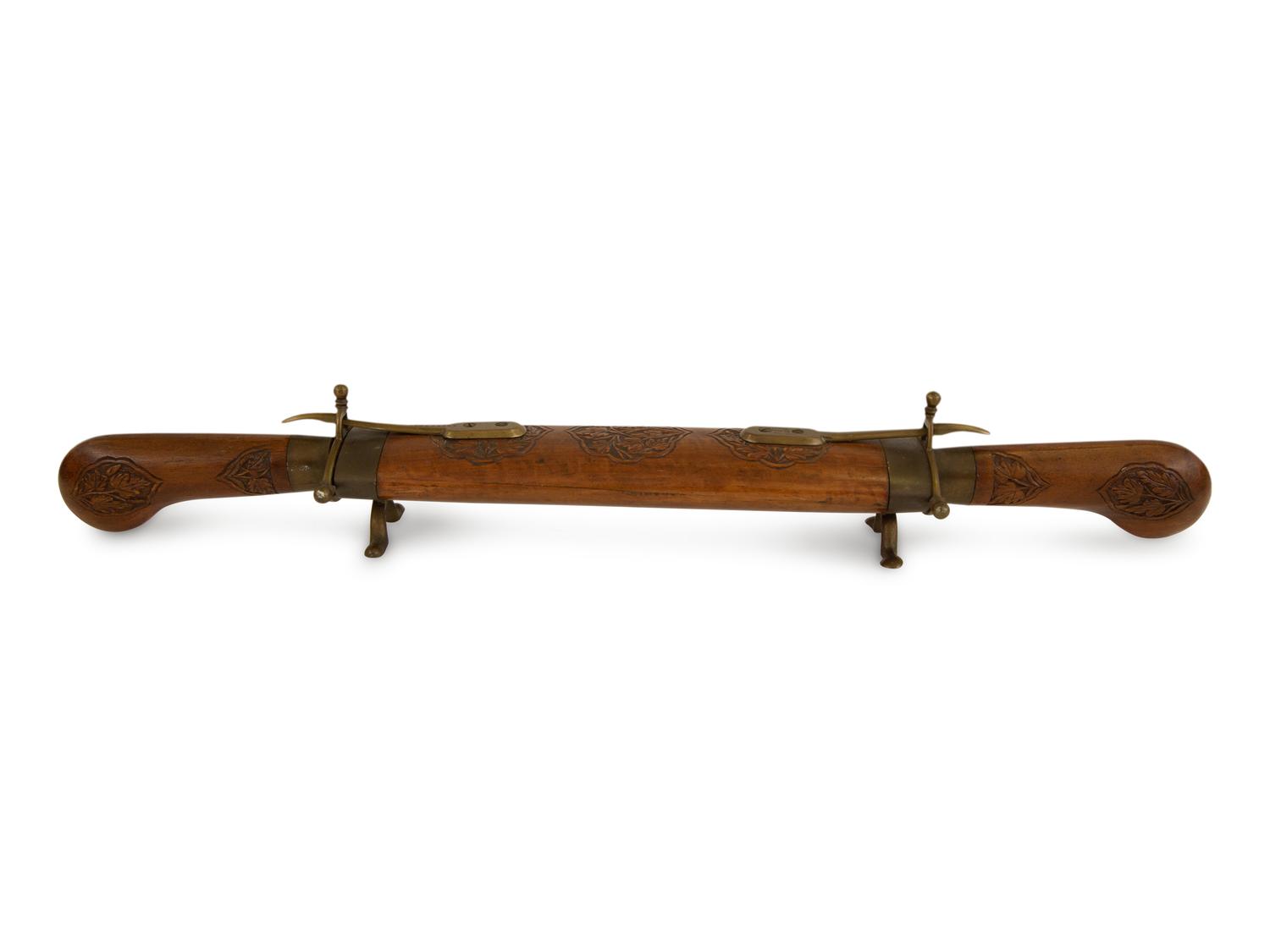 An Indian Carved Hardwood and Brass Dagger and Display Sheath