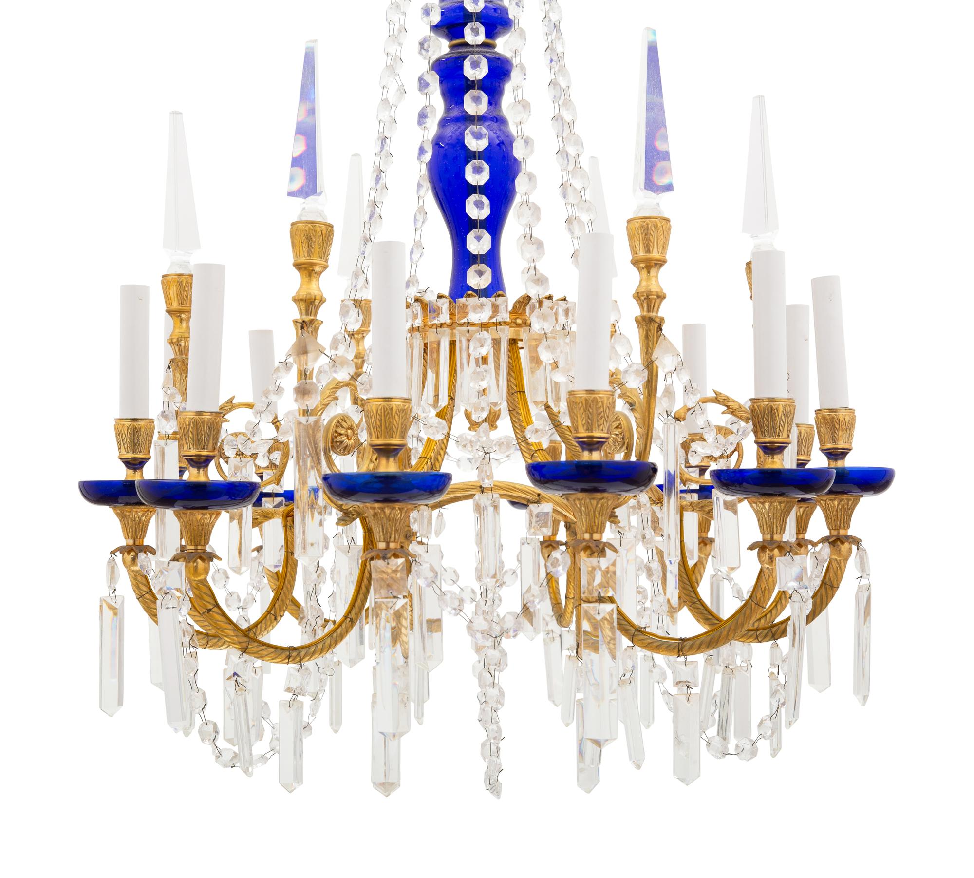 An Empire Style Gilt Bronze and Glass Twelve-Light Chandelier