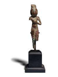 An Egyptian Bronze Concubine Holding a Duck