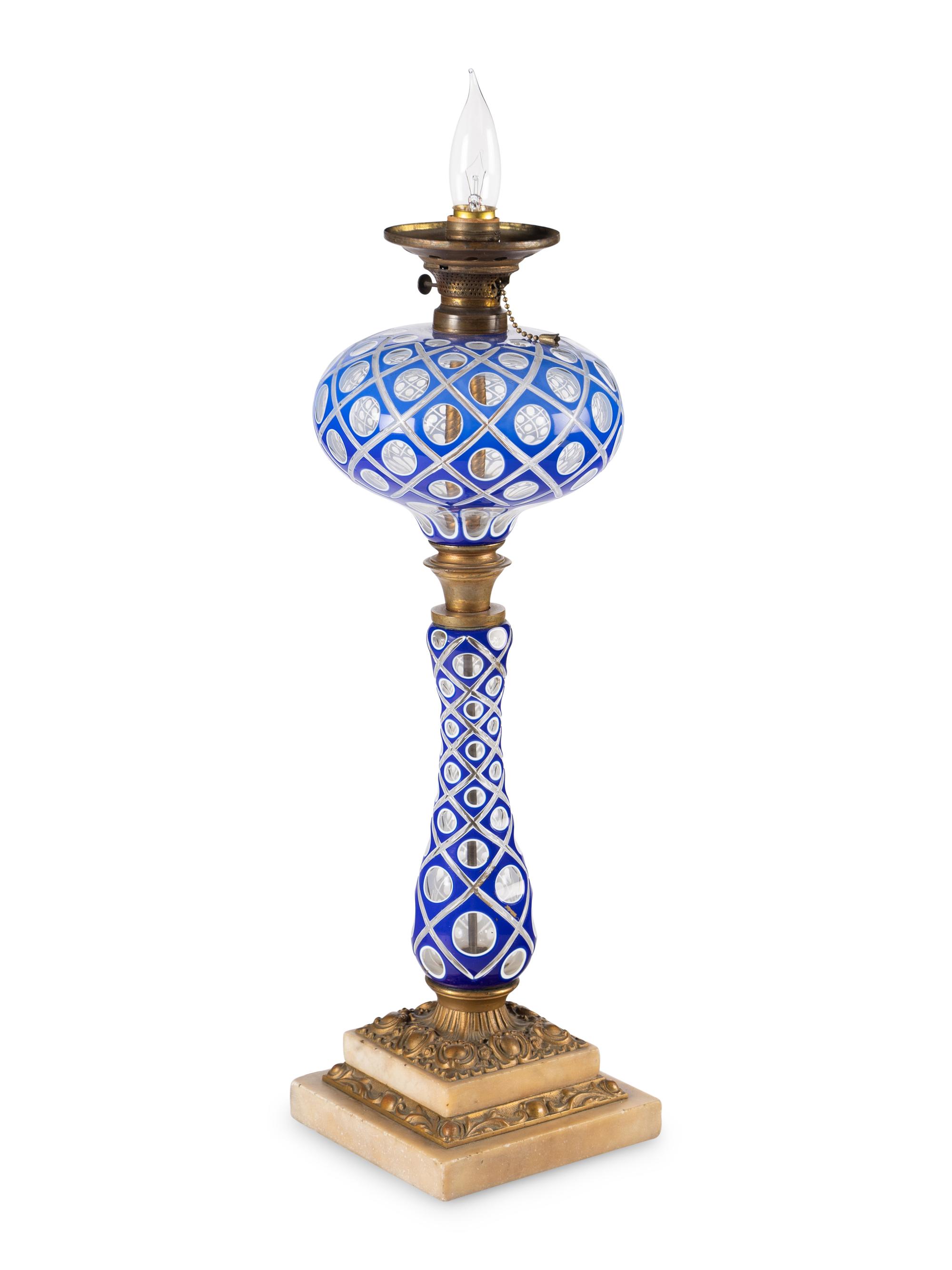 A Blue and White Overlay Cut to Clear Glass Fluid Lamp