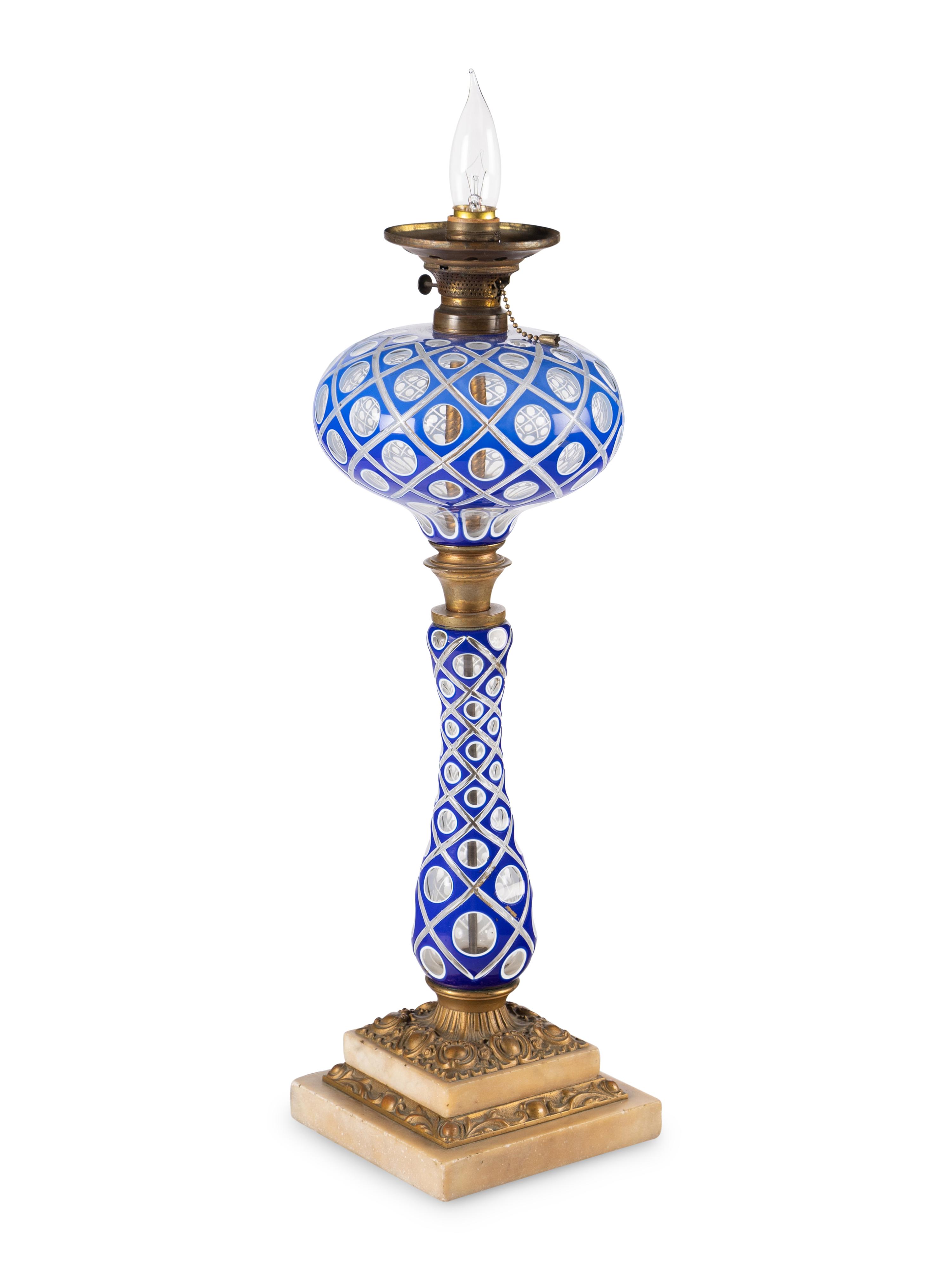 A Blue and White Overlay Cut to Clear Glass Fluid Lamp