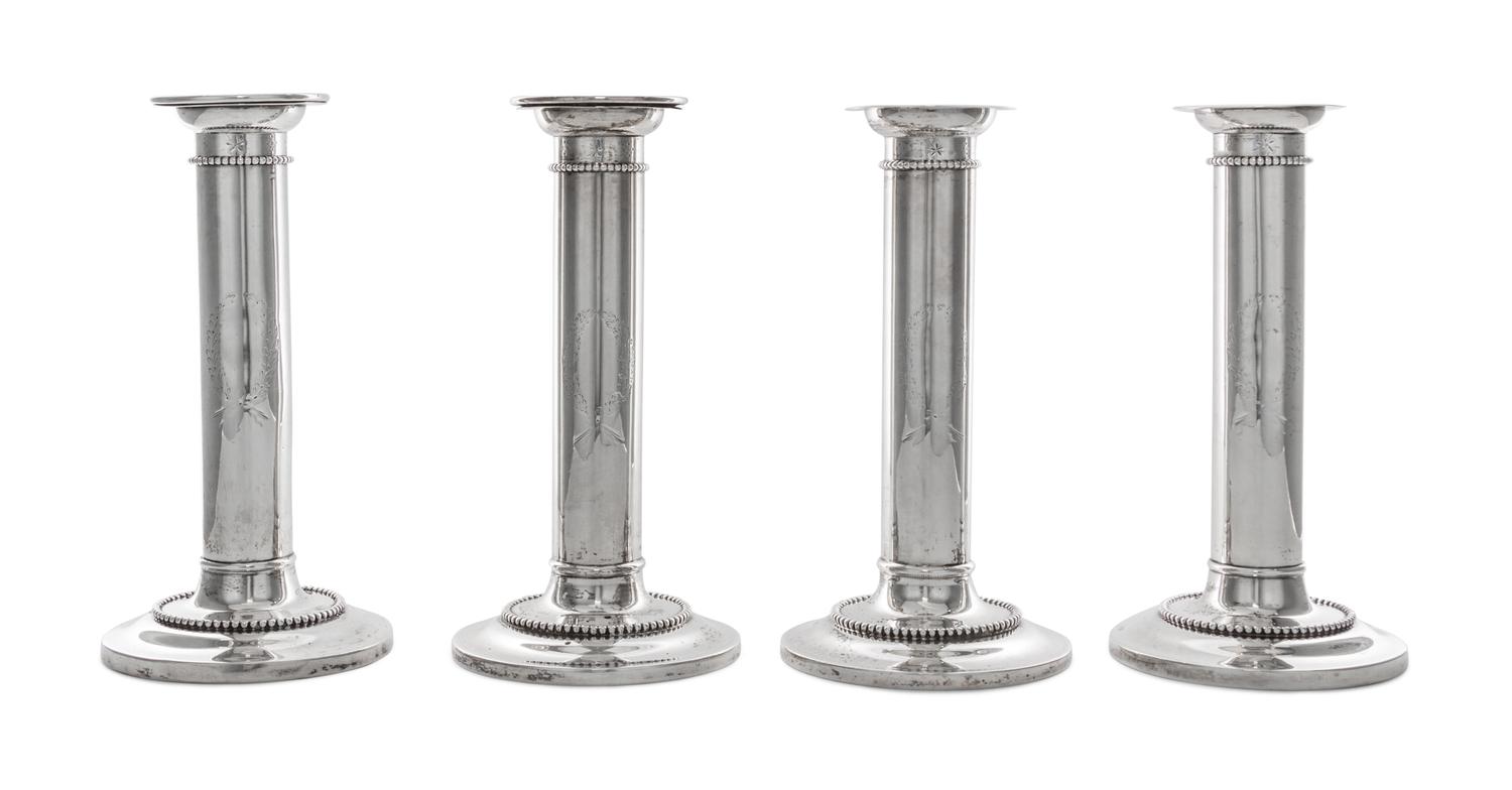 A Set of Four American Silver Candlesticks, Goodnow & Jenks, Boston, MA, retailed by Spaulding & Co., each of columnar form with beaded