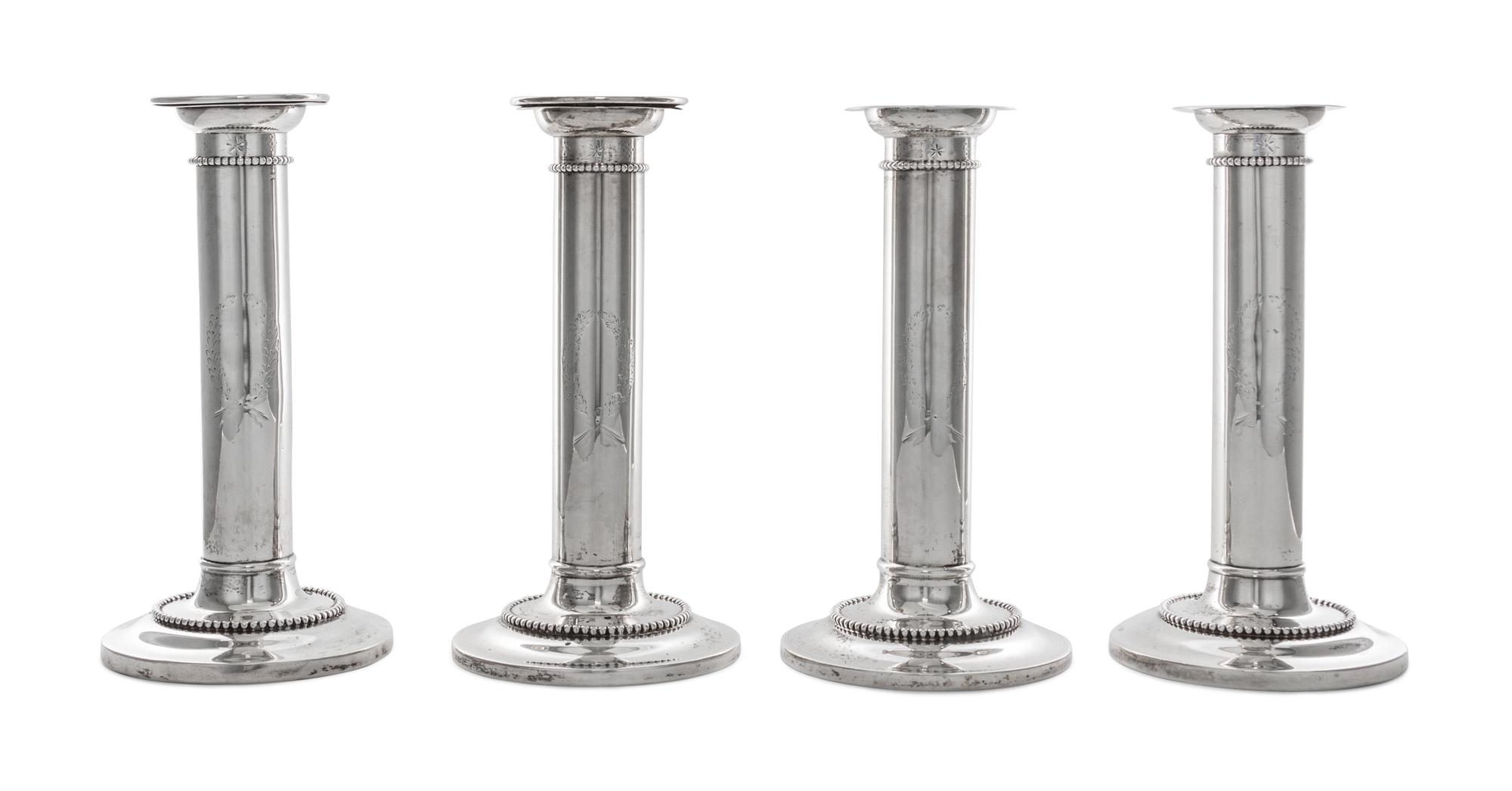 A Set of Four American Silver Candlesticks, Goodnow & Jenks, Boston, MA, retailed by Spaulding & Co., each of columnar form with beaded