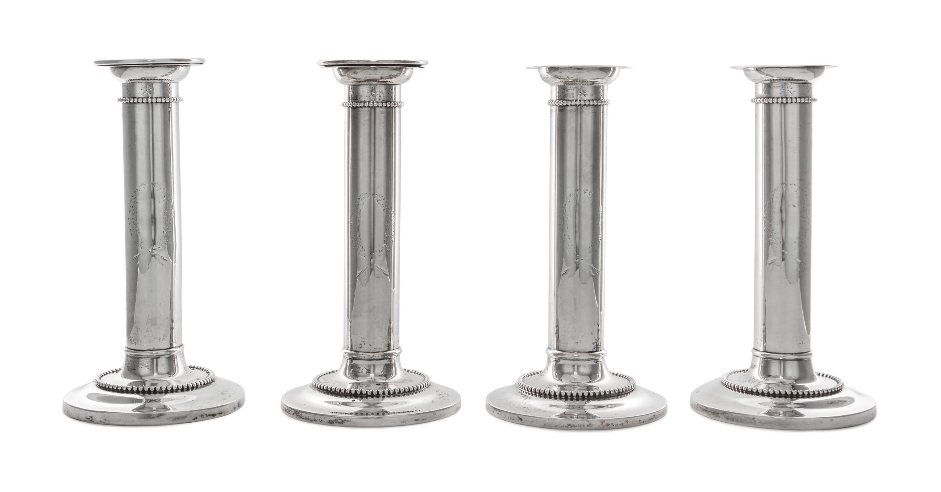 A Set of Four American Silver Candlesticks, Goodnow & Jenks, Boston, MA, retailed by Spaulding & Co., each of columnar form with beaded