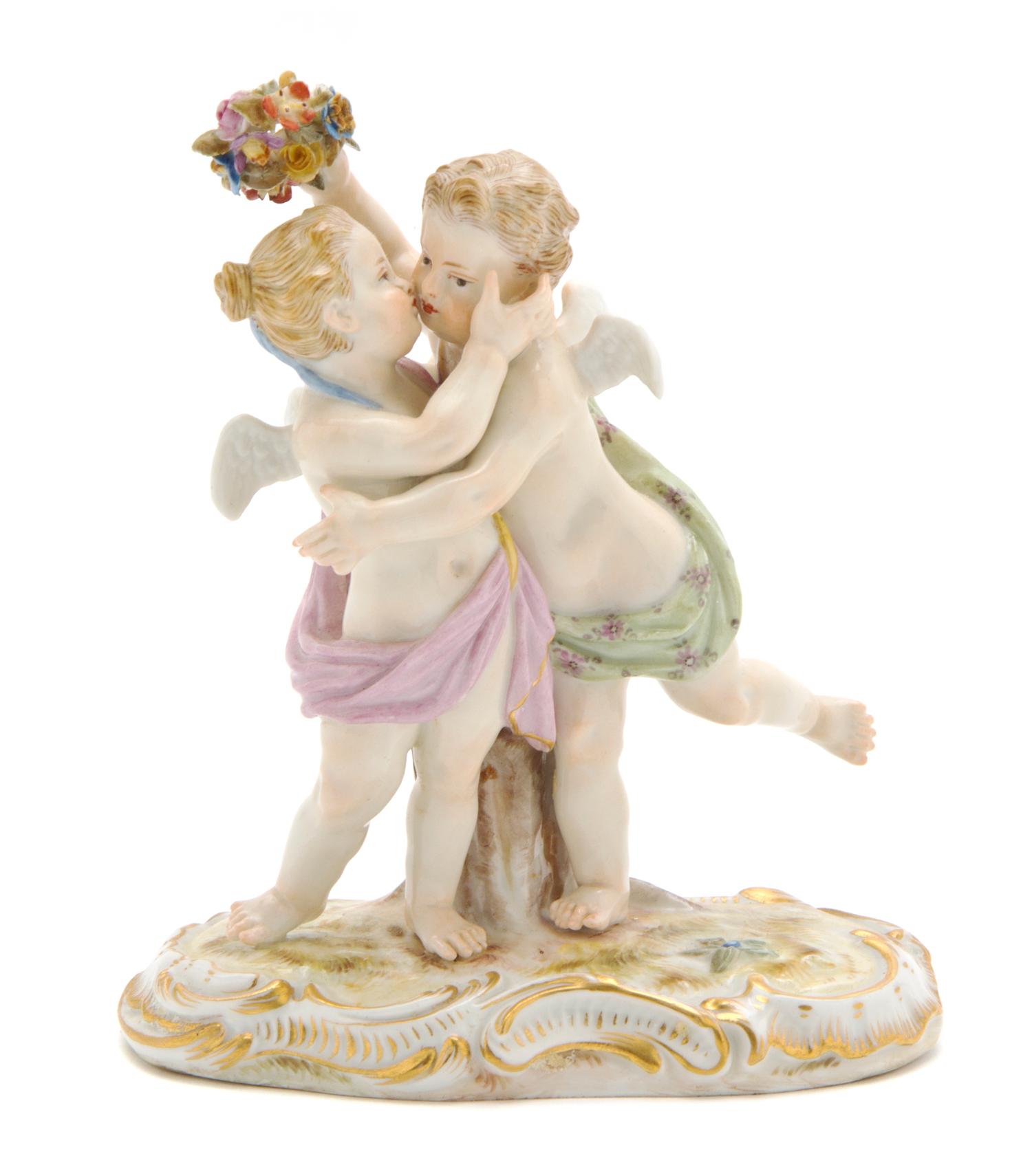 A Meissen Porcelain Figural Group, Height 5 inches.