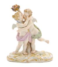 A Meissen Porcelain Figural Group, Height 5 inches.