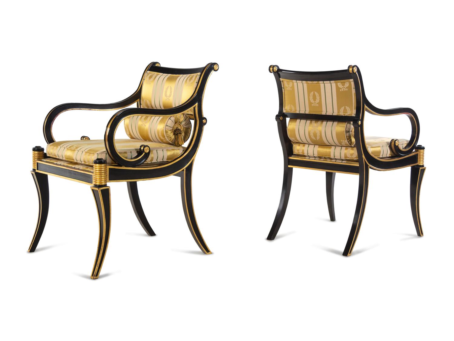 A Pair of Regency Style Parcel Gilt and Ebonized Armchairs