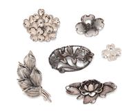 A Collection of Sterling Silver Floral Motif Brooches,