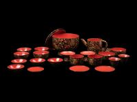 A Japanese Gold Decorated Brown and Red Lacquer Tableware Set