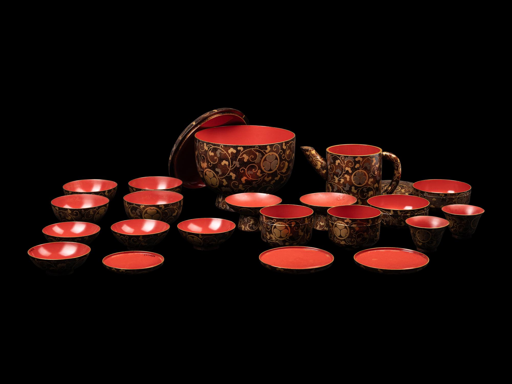 A Japanese Gold Decorated Brown and Red Lacquer Tableware Set