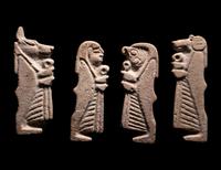 A Set of Four Sons of Horus, Two Scarab Wings, and Two Heads of Horus as a Falcon