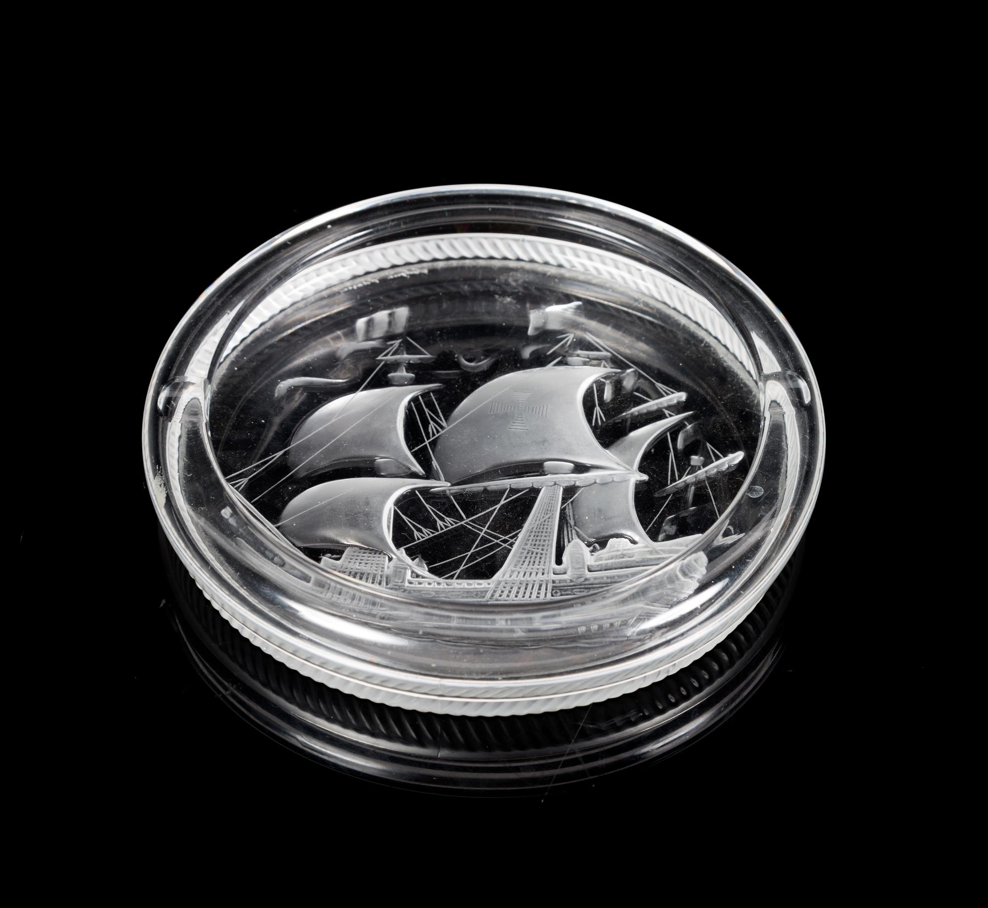 Lalique, a molded and frosted glass ash receiver, decorated with a ship