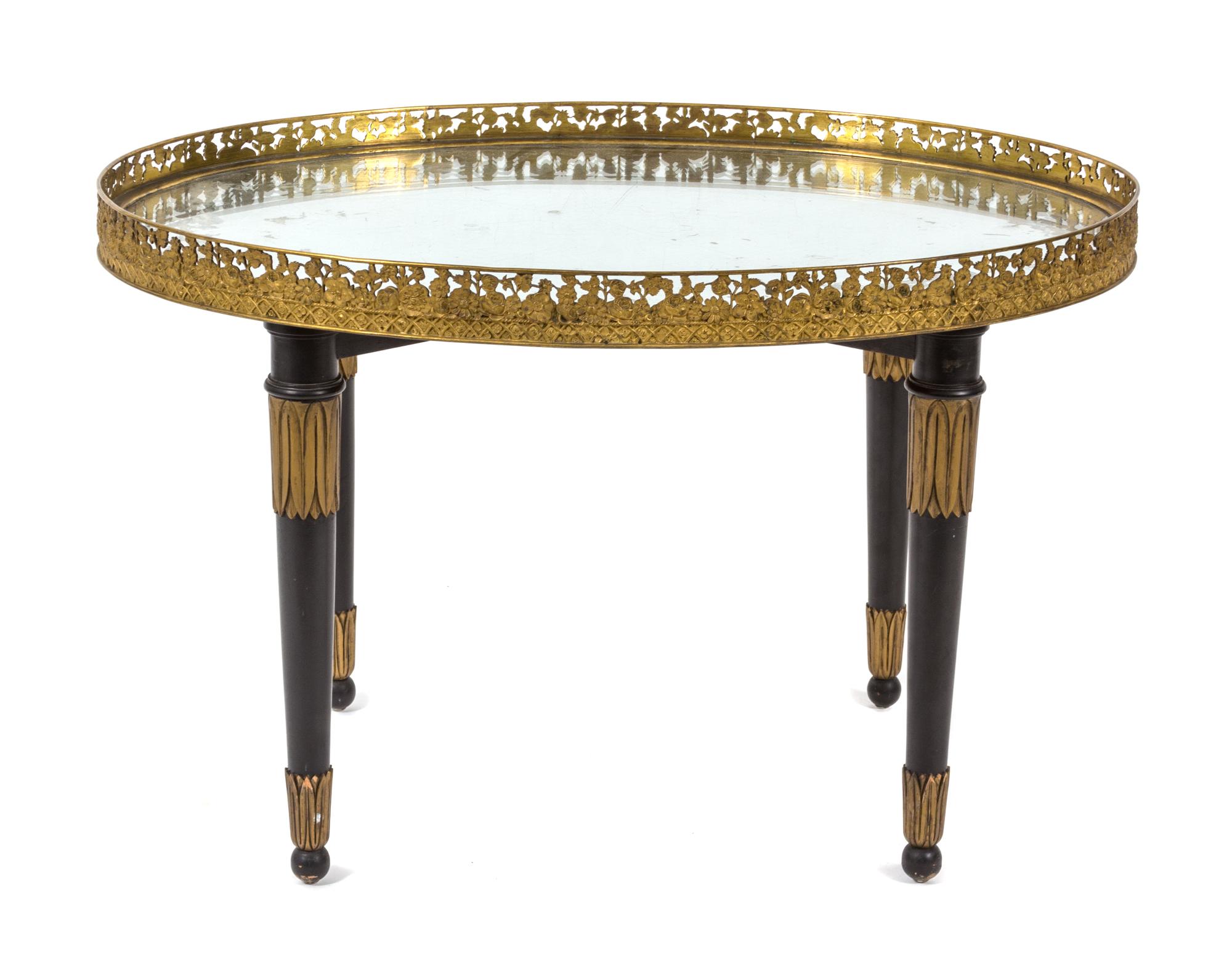 A Neoclassical Style Ebonized Oval Tray Top Table Height 19 1/2 x width 30 1/2 x depth 21 3/4 inches. — 19TH CENTURY