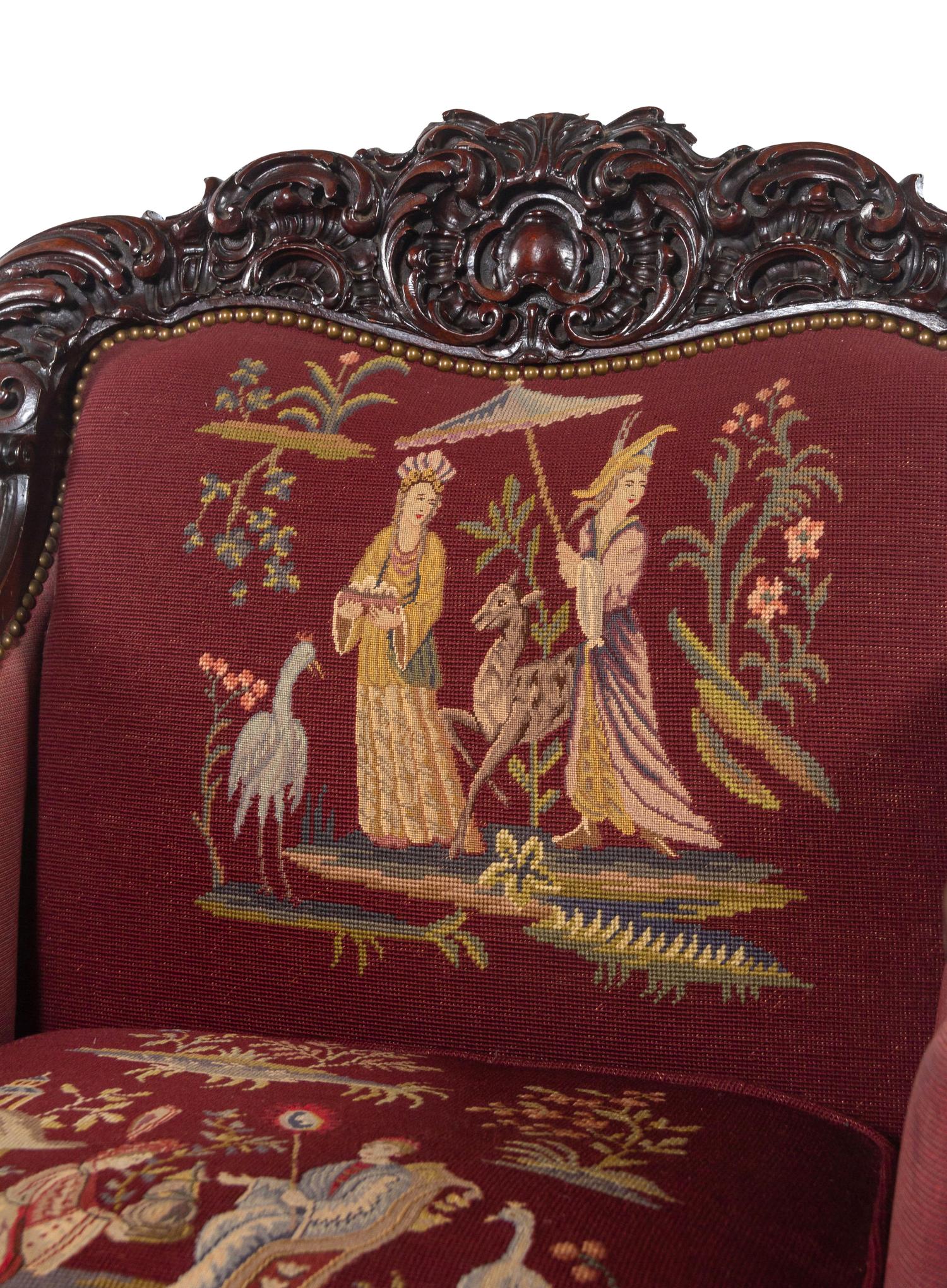 A Rococo Revival Carved Walnut Three-Piece Seating Suite in the Style of Karpen