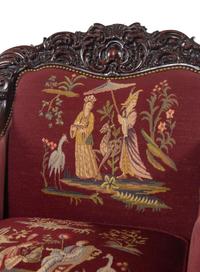 A Rococo Revival Carved Walnut Three-Piece Seating Suite in the Style of Karpen
