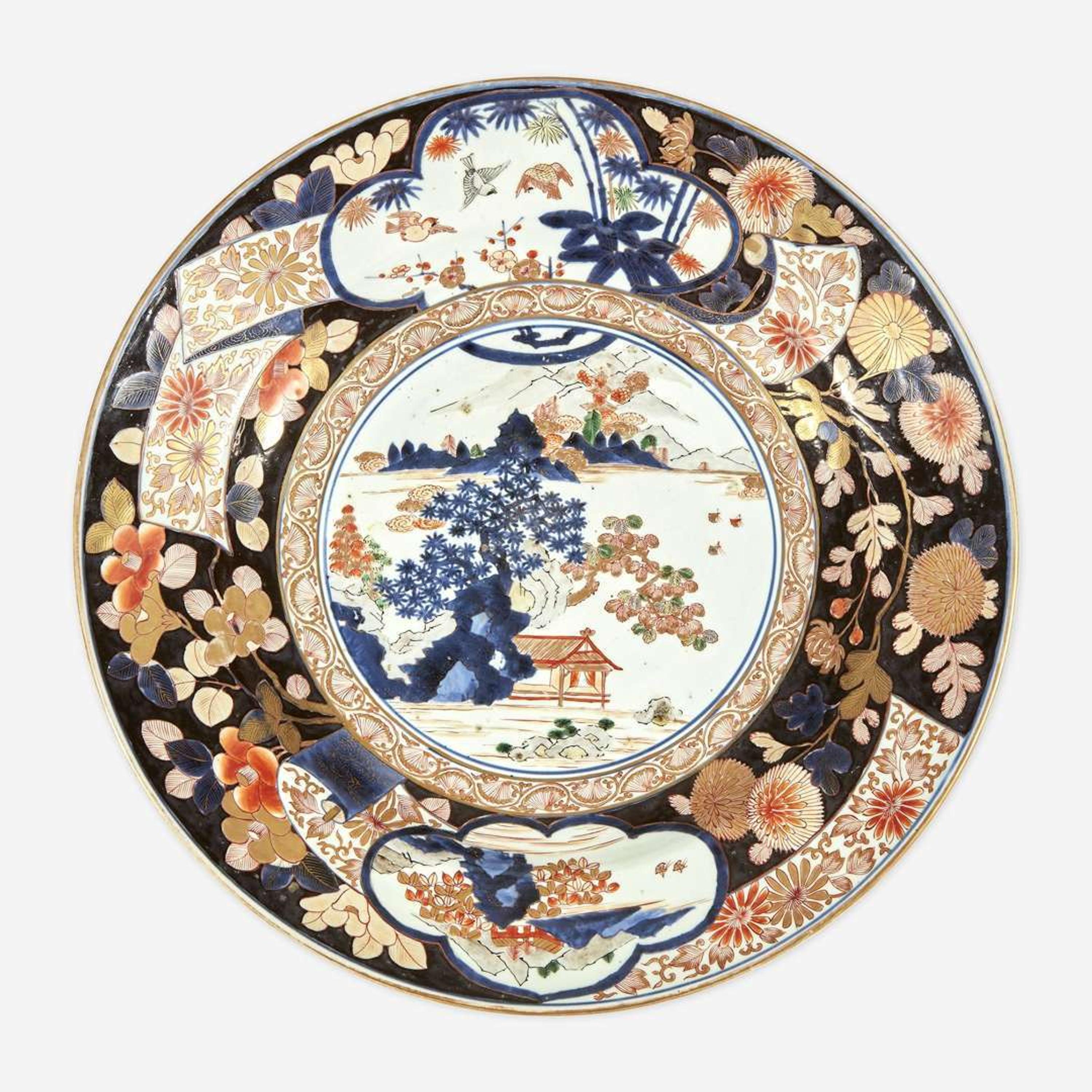 Three Massive Imari chargers The pair Meiji period, the third circa 1700-1725