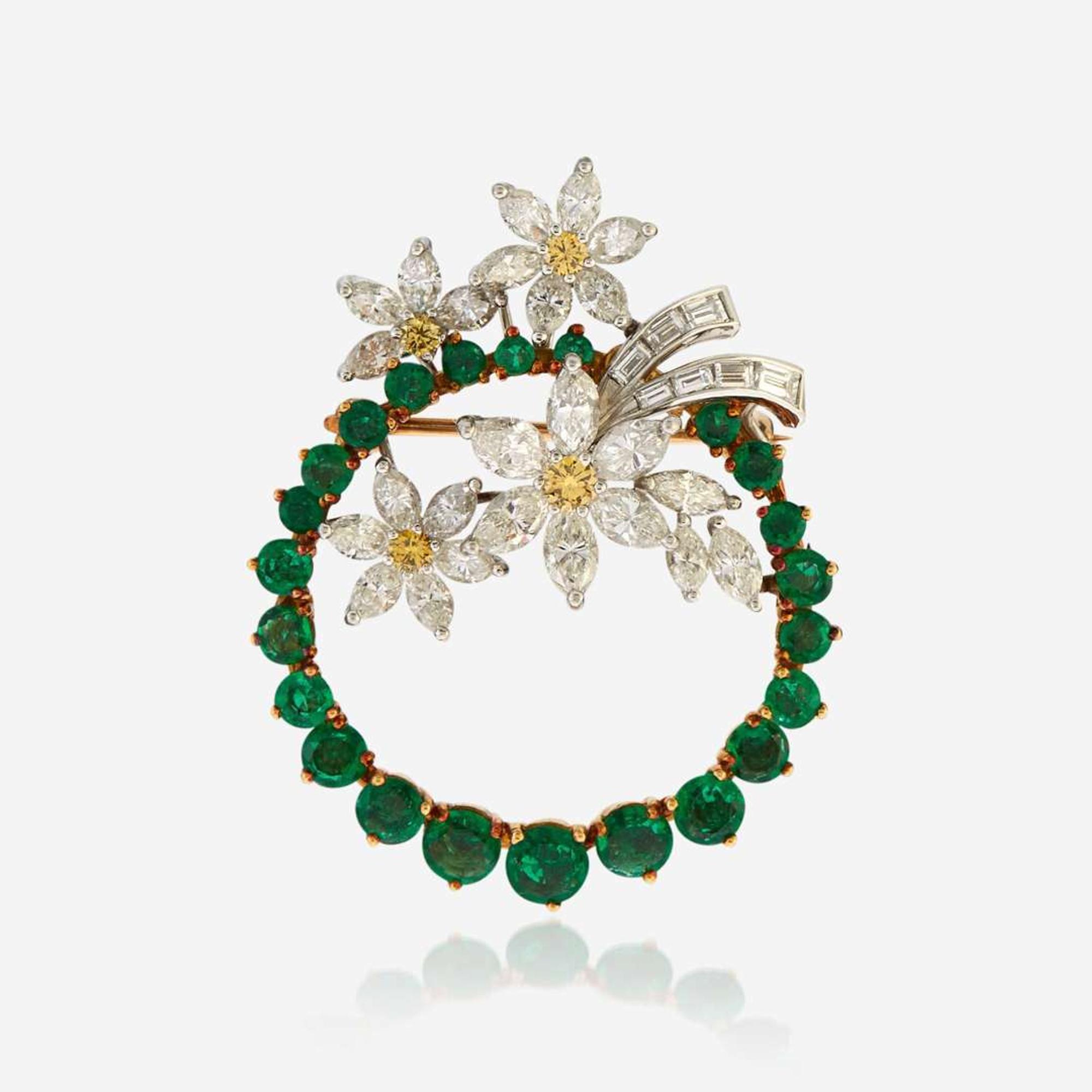 An emerald, diamond, colored diamond, gold, and platinum pendant/brooch