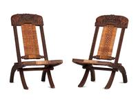 A Pair of Anglo-Indian Elephant-Carved Teak Cane Upholstered Folding Campaign Chairs