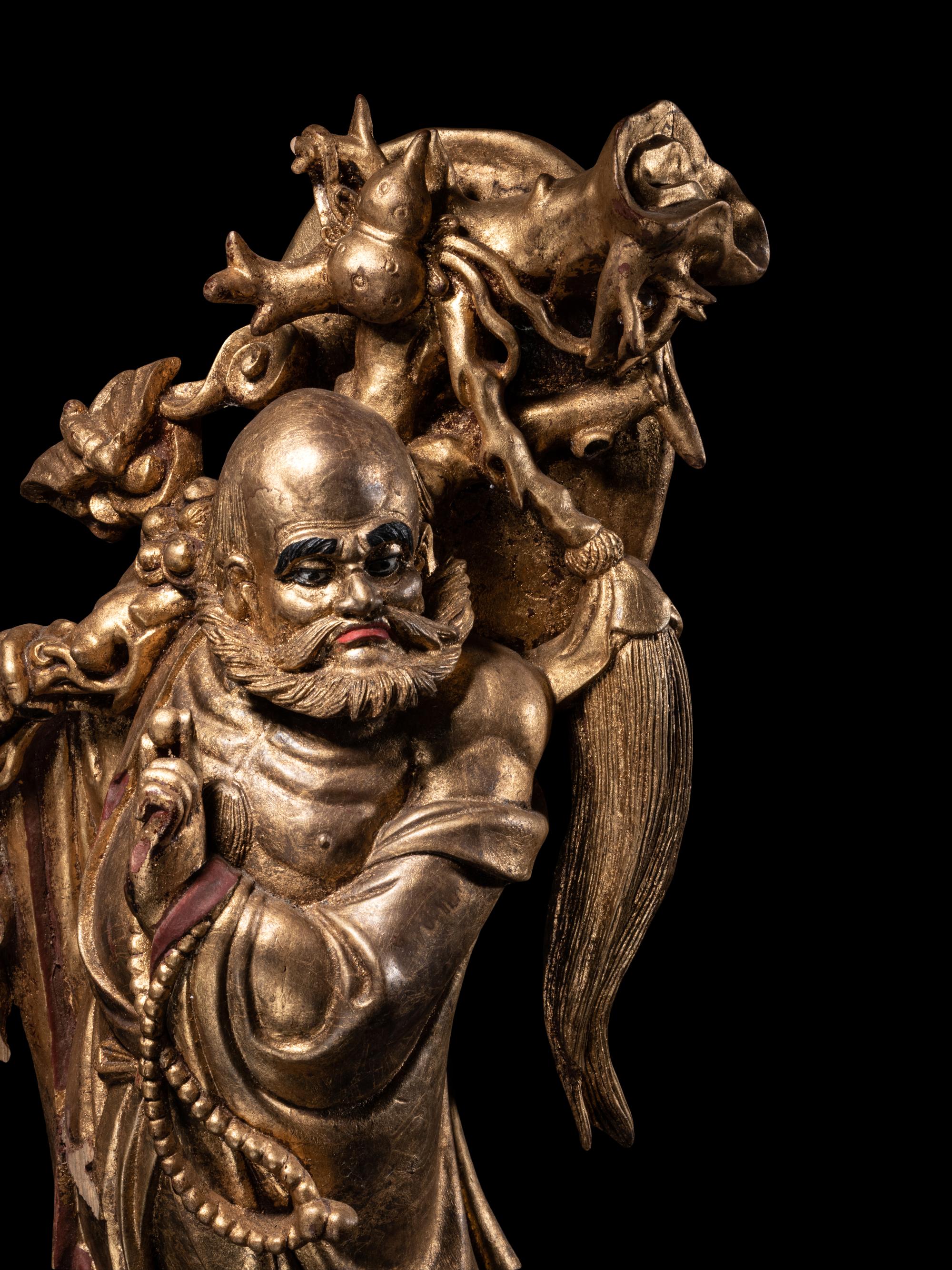 A Chinese Gilt Lacquered Wood Figure of Immortal