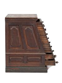 A Nine Drawer Counter Top Spool Cabinet