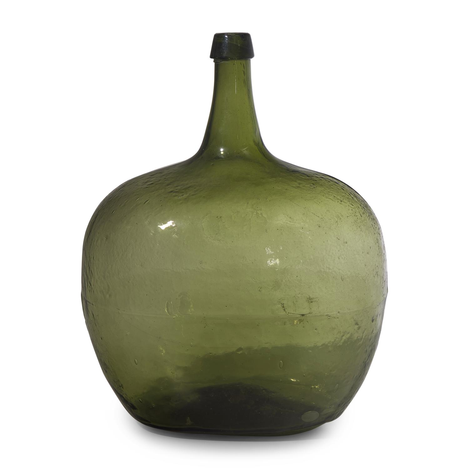 A Blown and Molded Green Glass Demijohn