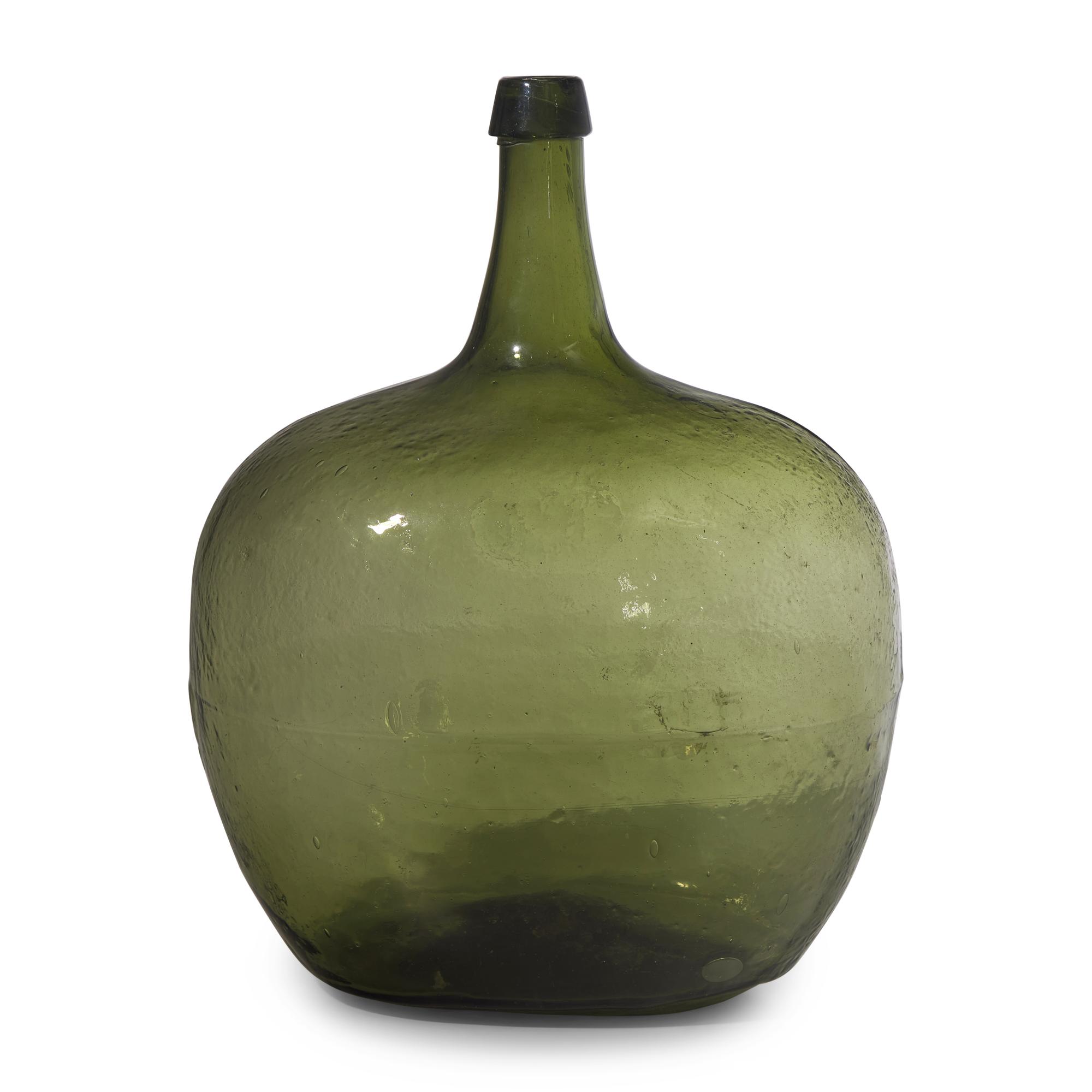A Blown and Molded Green Glass Demijohn
