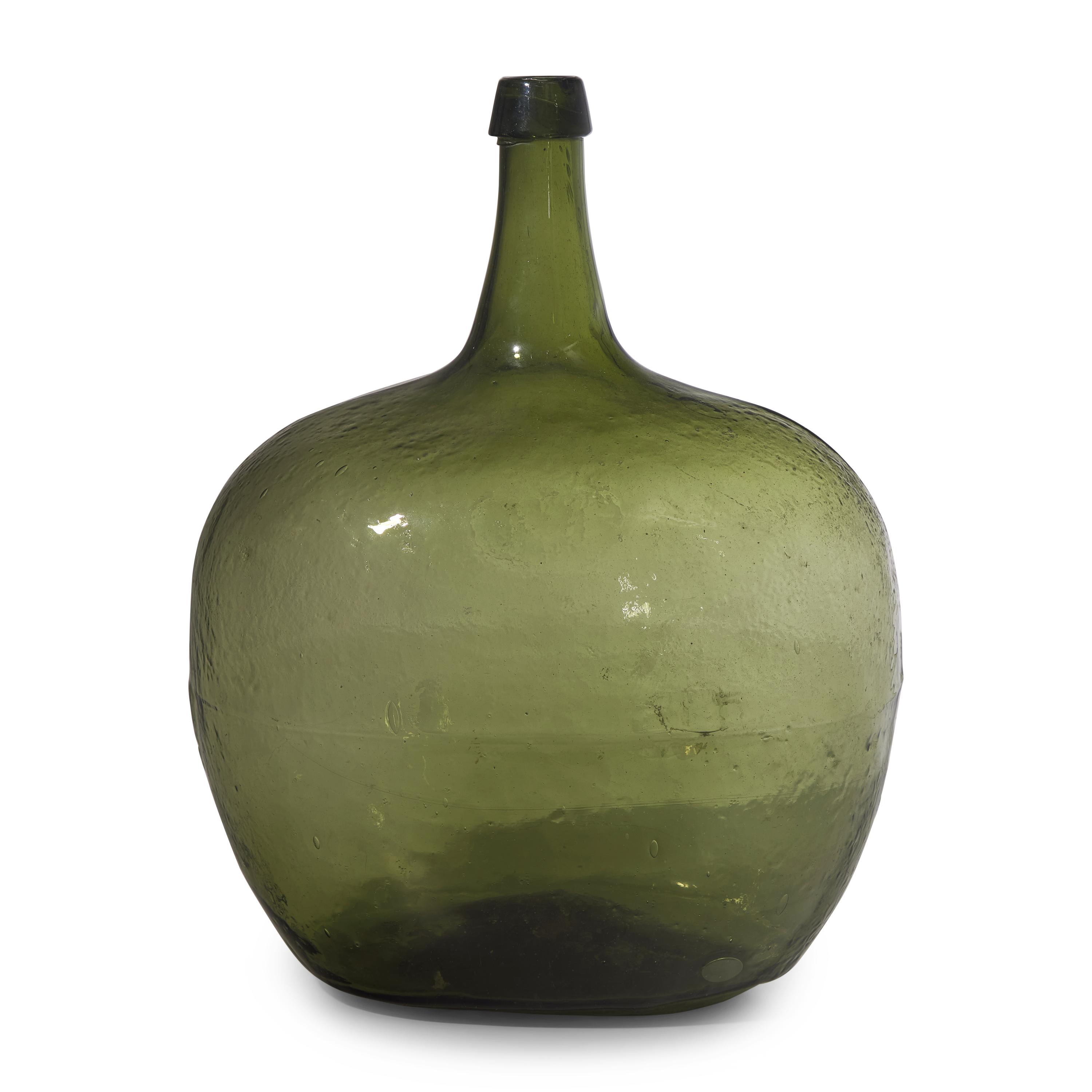 A Blown and Molded Green Glass Demijohn