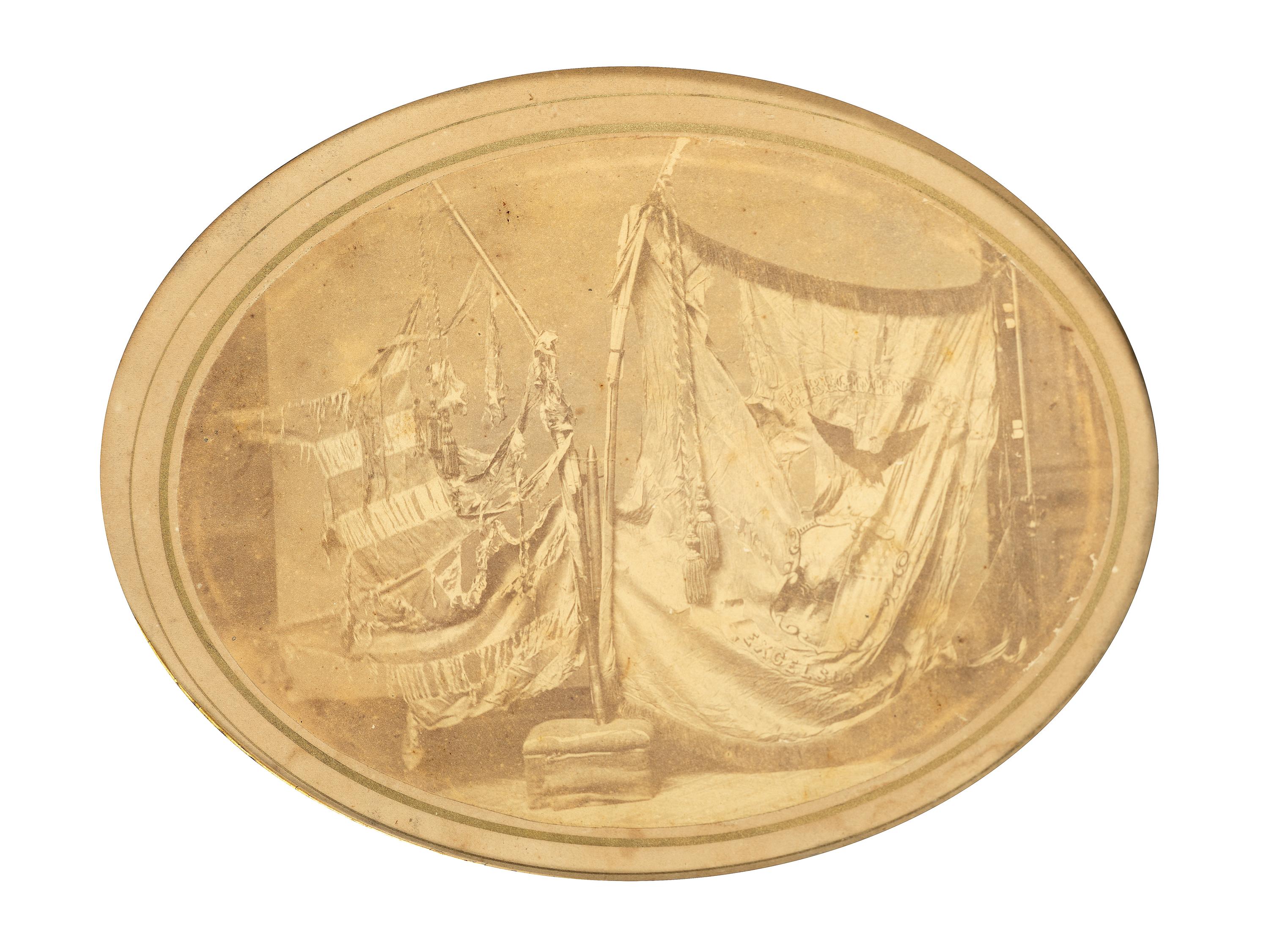 [CIVIL WAR]. Albumen photograph of the battle-damaged flags of the 75th New York Infantry.
