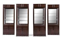 A Set of Four Chinese Zitan Veneer Hardwood Display Cabinets Height 85 x width 32 1/4 x depth 15 inches. — CABINET: 20TH CENTURY; CARVED PANELS: 19TH CENTURY