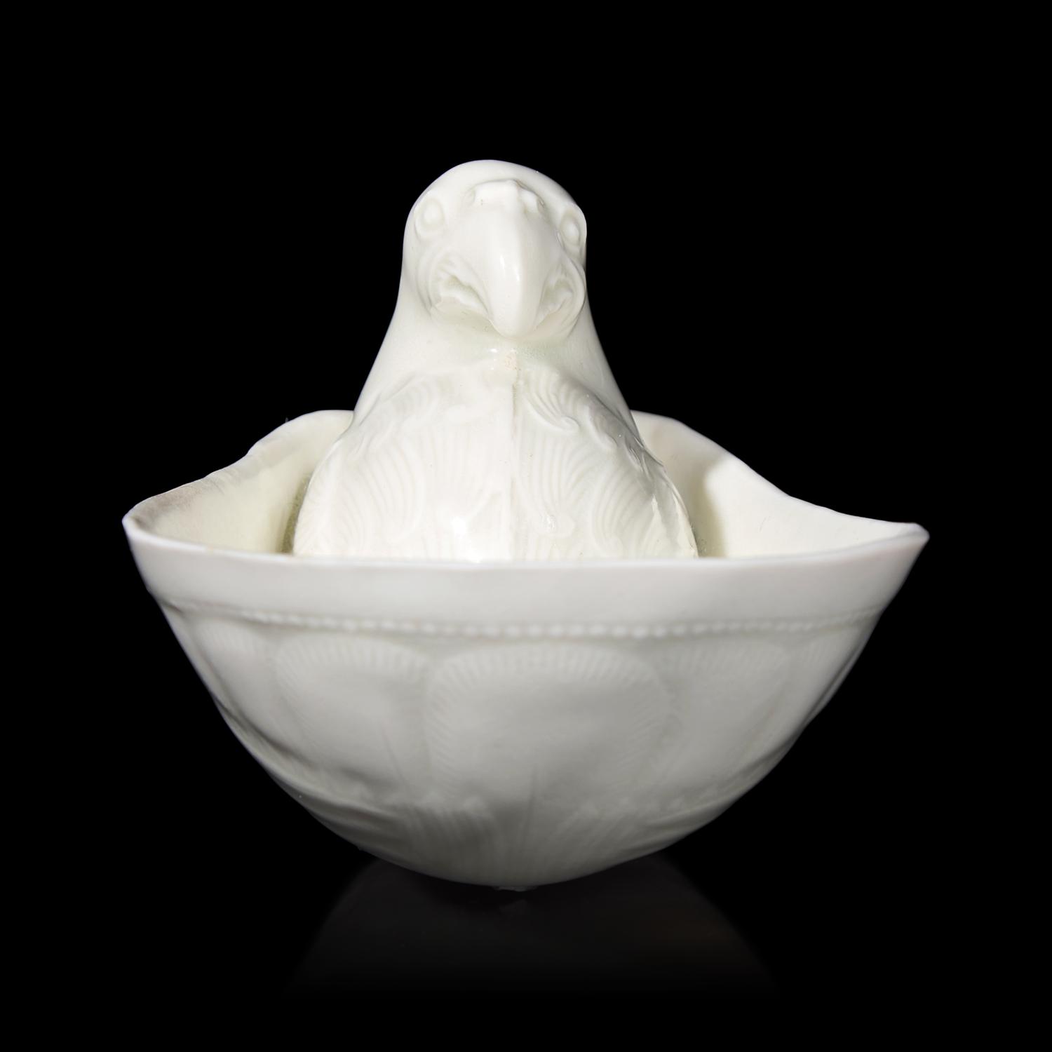 A Chinese Transparent Glazed 'Parrot' Cup, Song Dynasty 宋 白瓷鸚鵡杯
