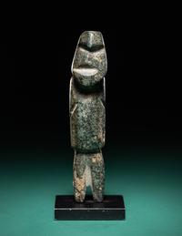 A Mezcala Diorite Standing Figure with an Infant