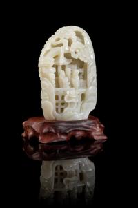 A Carved White Jade Boulder Height of jade 6 5/8 inches.