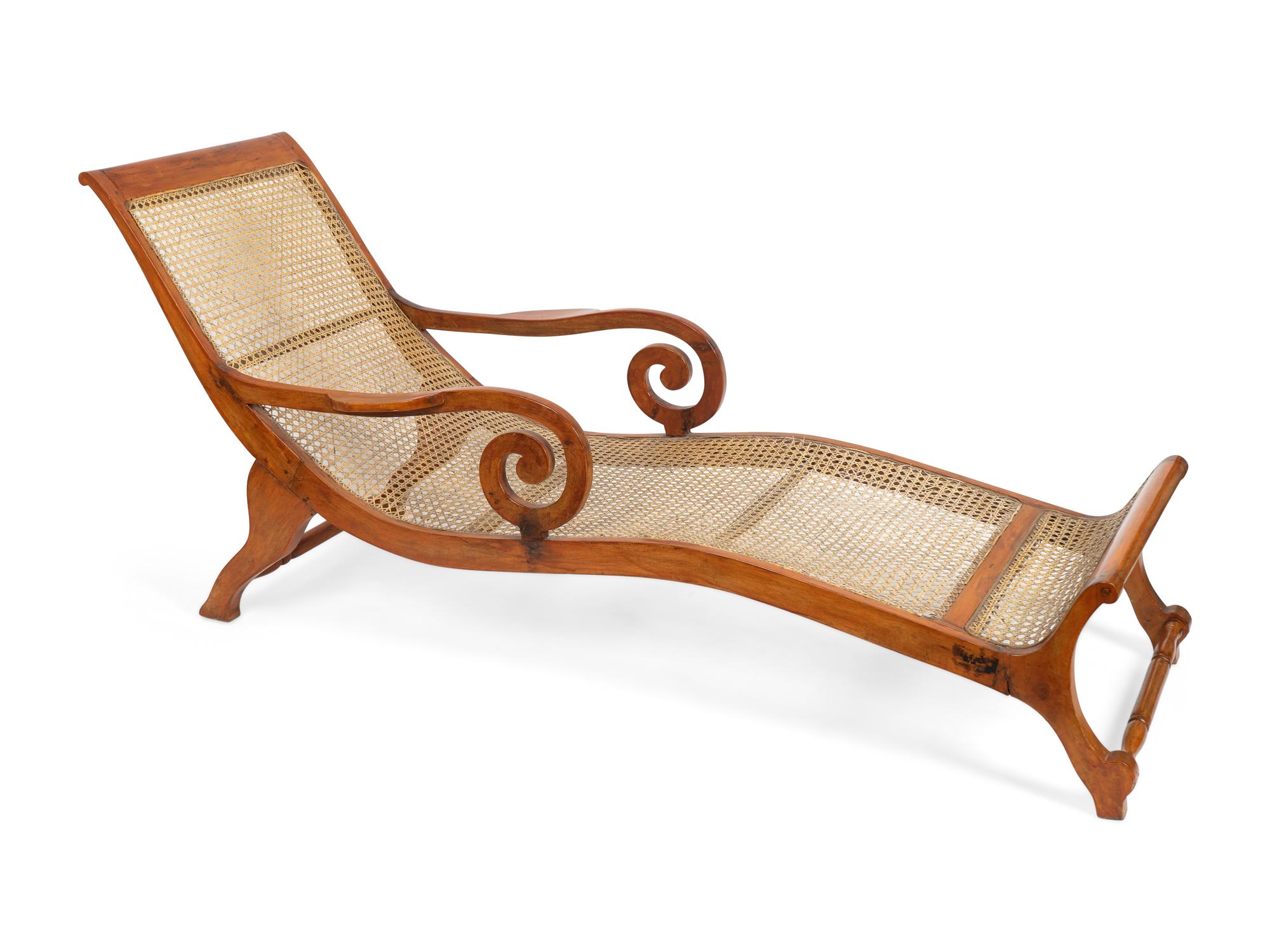 A British Colonial Caned Teak Chaise Longue — 19TH CENTURY