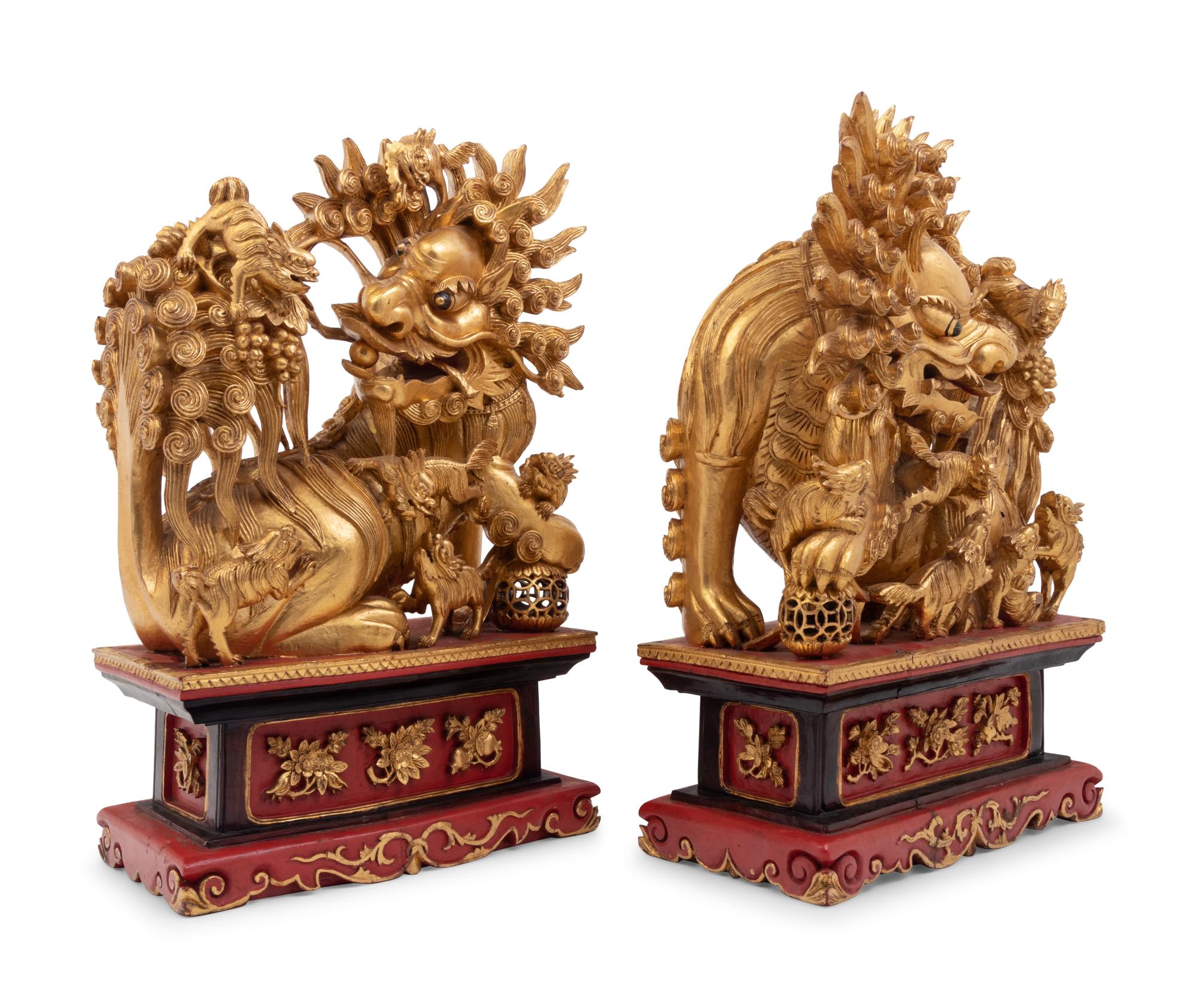 A Pair of Chinese Carved Giltwood Ornaments
