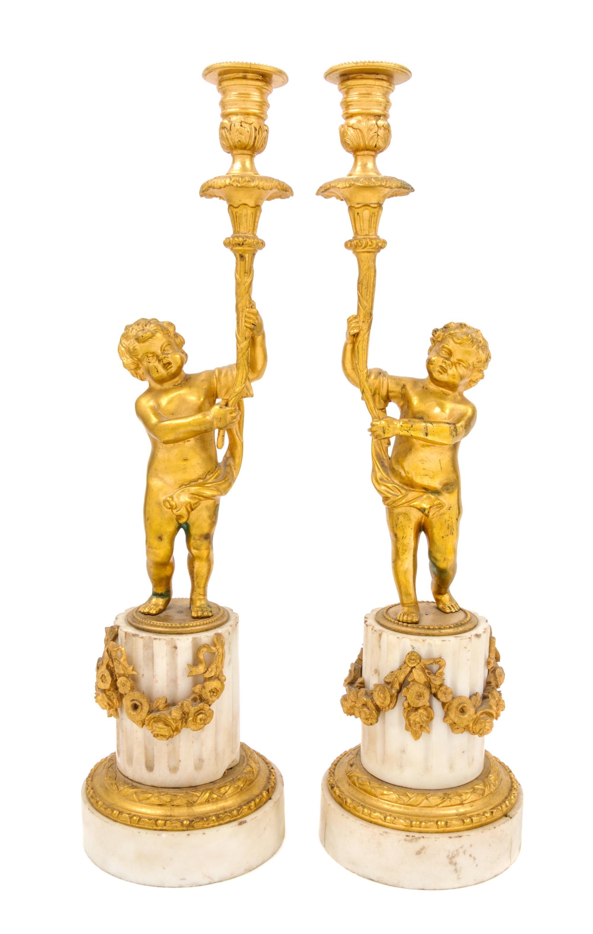 A Pair of Louis XVI Style Gilt Bronze and Marble Figural Candlesticks Height 16 1/2 inches.