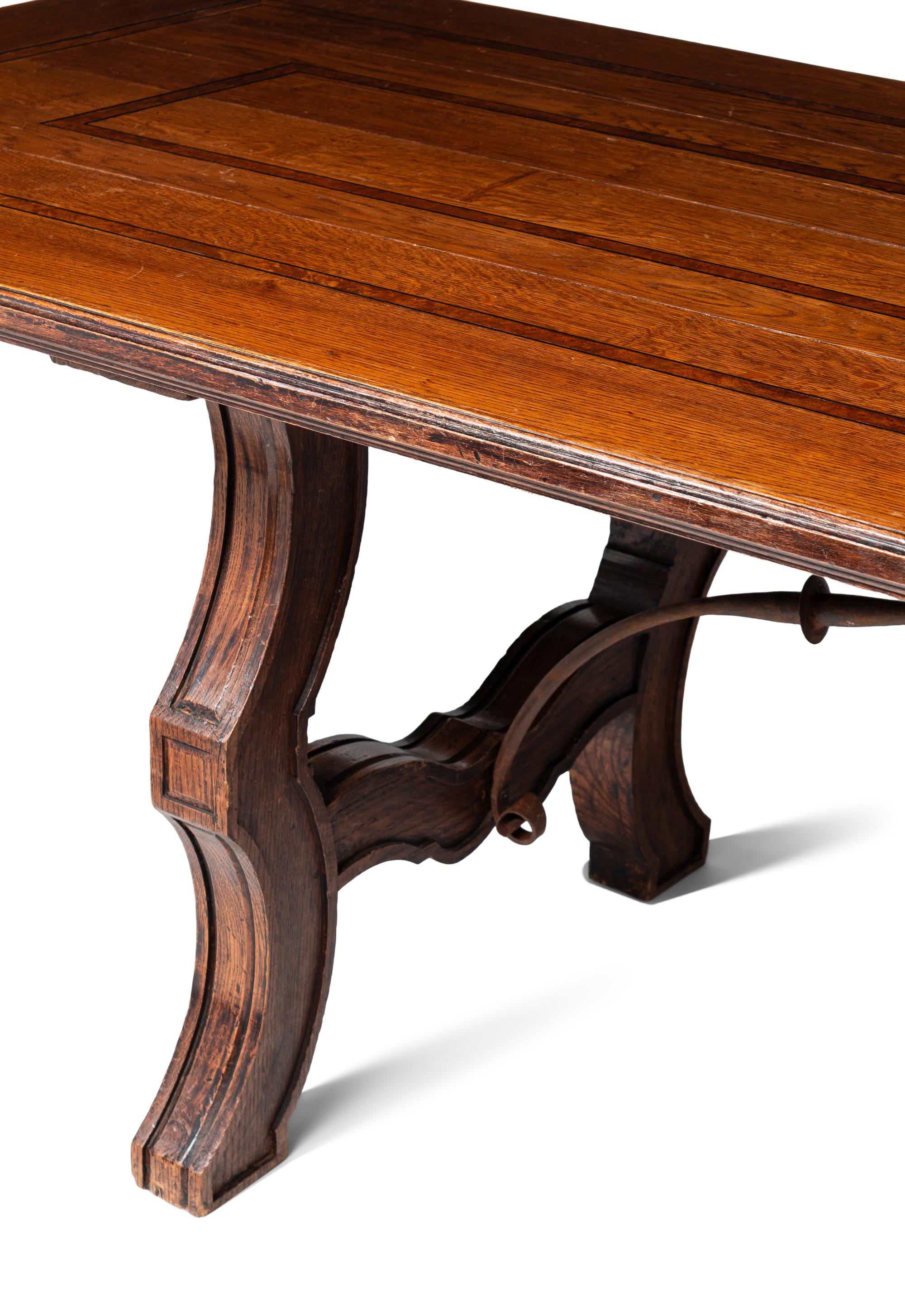 A Large Italian Renaissance Style Iron Mounted Oak and Burl Walnut Library Table
