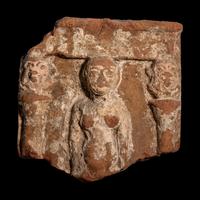 An Egyptian Terracotta Fragment with Concubine Flanked by Bes-Shaped Columns